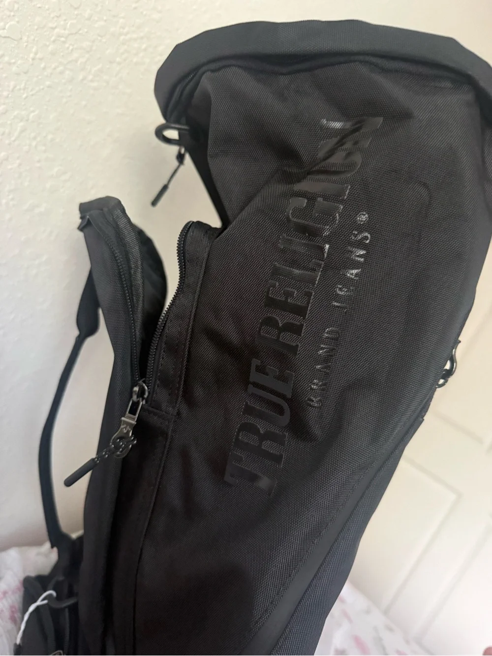True Religion Black Sling Backpack with Subtle Logo